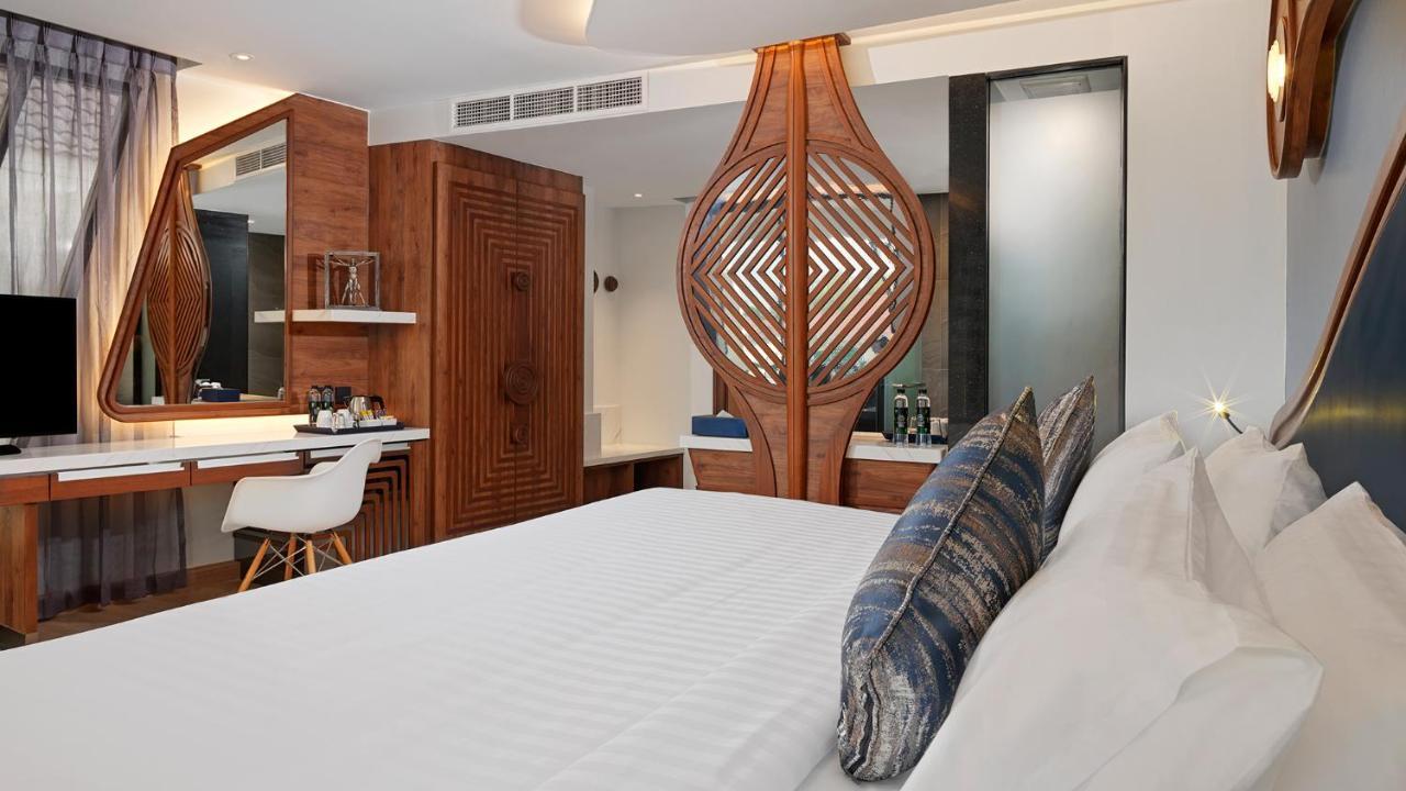 The Oceanic Sportel Phuket - Sha Extra Plus Buitenkant foto A bedroom at the hotel