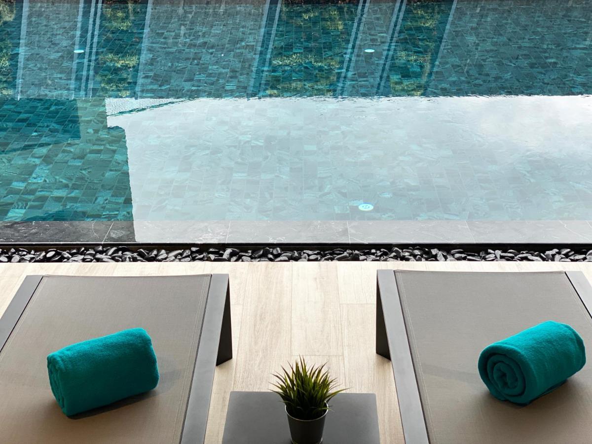 The Oceanic Sportel Phuket - Sha Extra Plus Buitenkant foto The swimming pool at the hotel