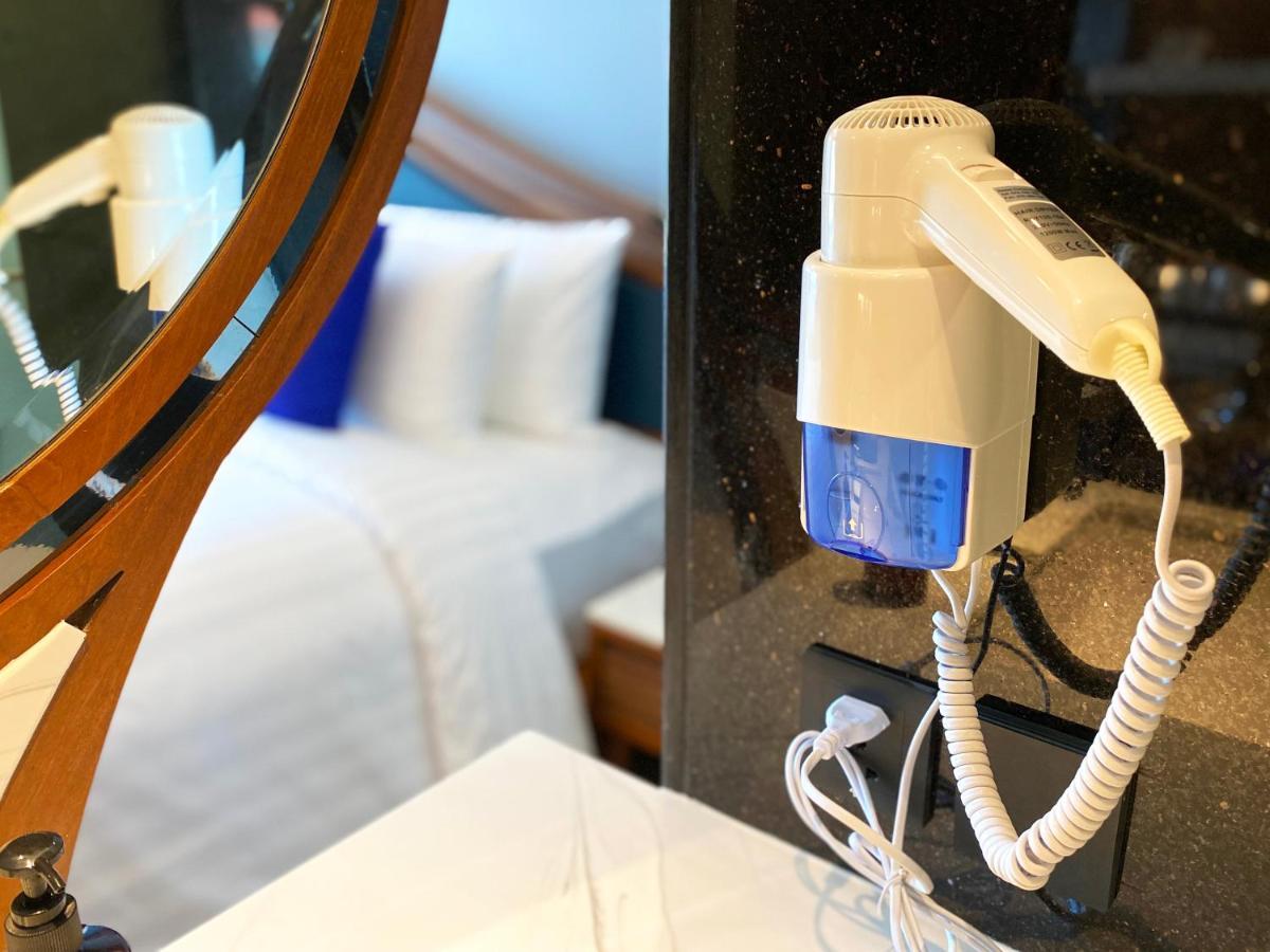 The Oceanic Sportel Phuket - Sha Extra Plus Buitenkant foto A hair dryer mounted on a wall